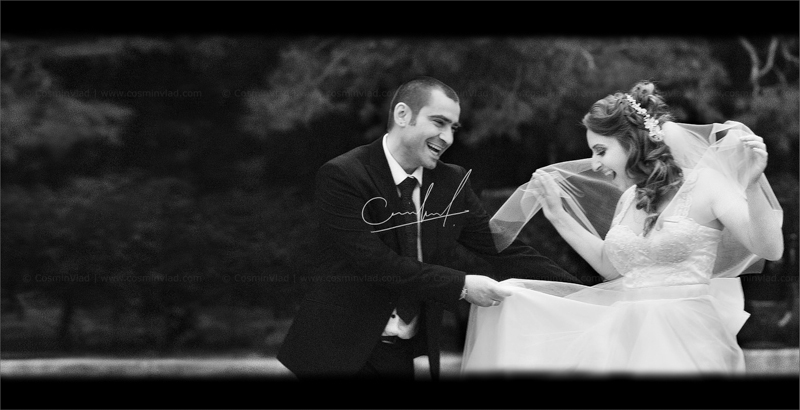 Bride and groom playing outside on their wedding day