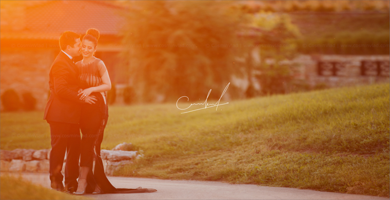 Couple cuddling outside at sunset during a destination wedding