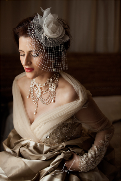 Bride wearing a victorian dress with victorian accesories and a birdcage veil