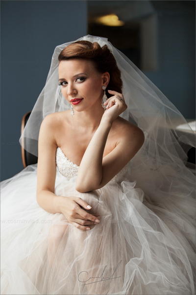 Natural portrait of a bride fixing her earing